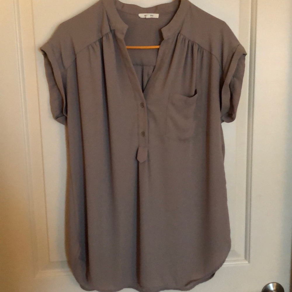 Cream colored short sleeve blouse